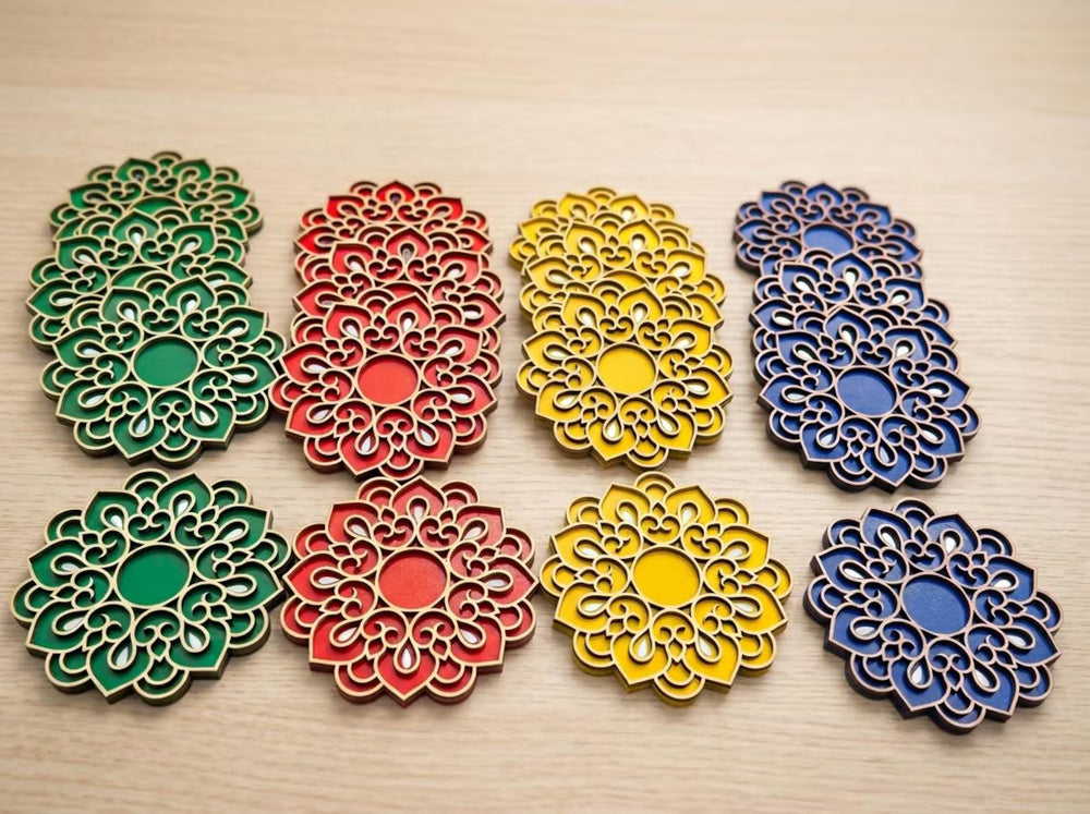 Floral wooden Diwali diya holders displayed in green, red, yellow and blue